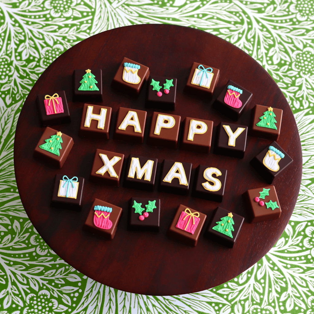 Thumbnail: Hand-iced assorted chocolate tin Image 1